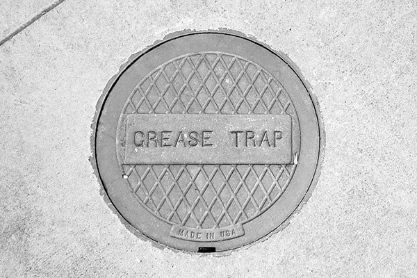 foul odors, slow draining water, and grease buildup are clear indicators that it is time for grease trap pumping
